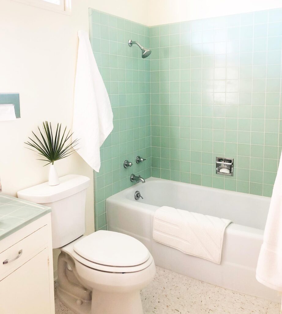 Retro Charm in a Seafoam Green Bathroom
