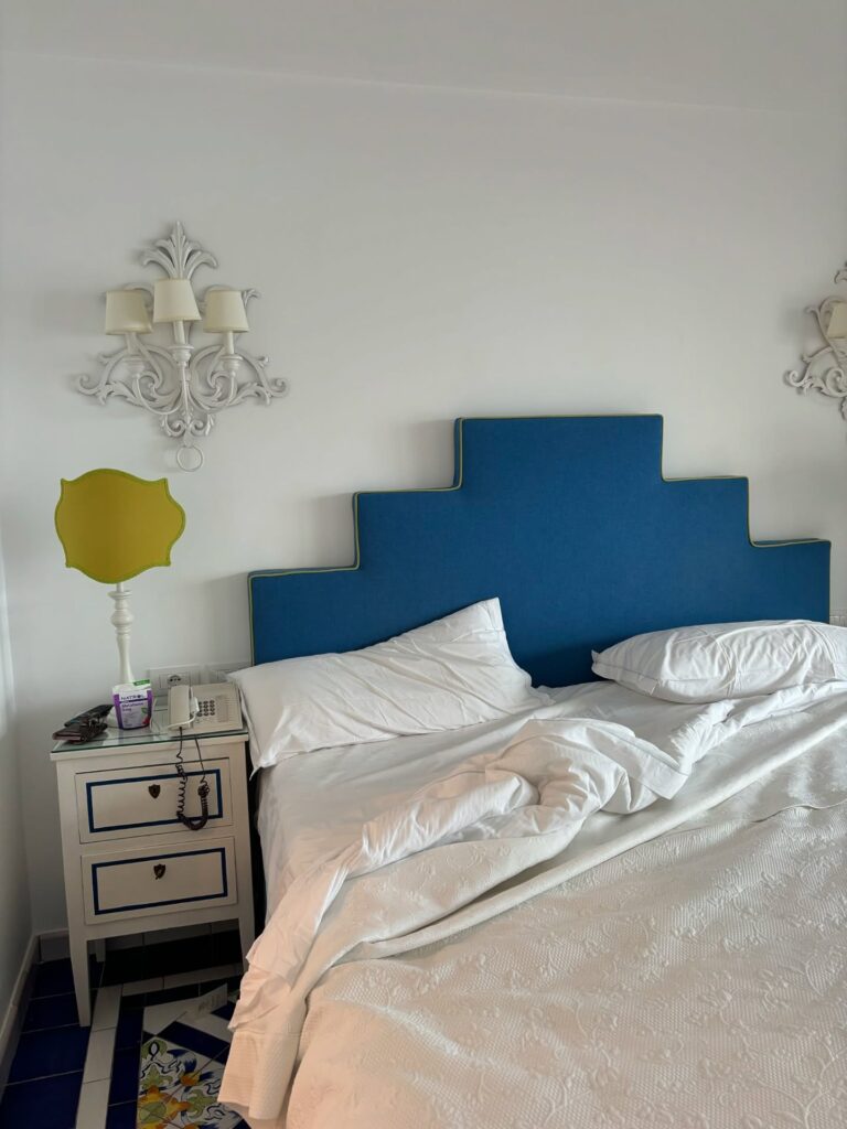 Bright Blue Headboard in a Simple Bedroom

