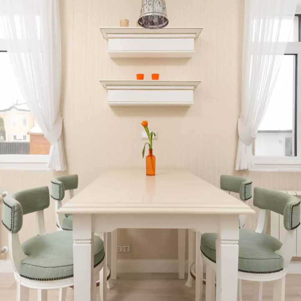 Bright and Cozy Dining Nook with Vertical Shelves

