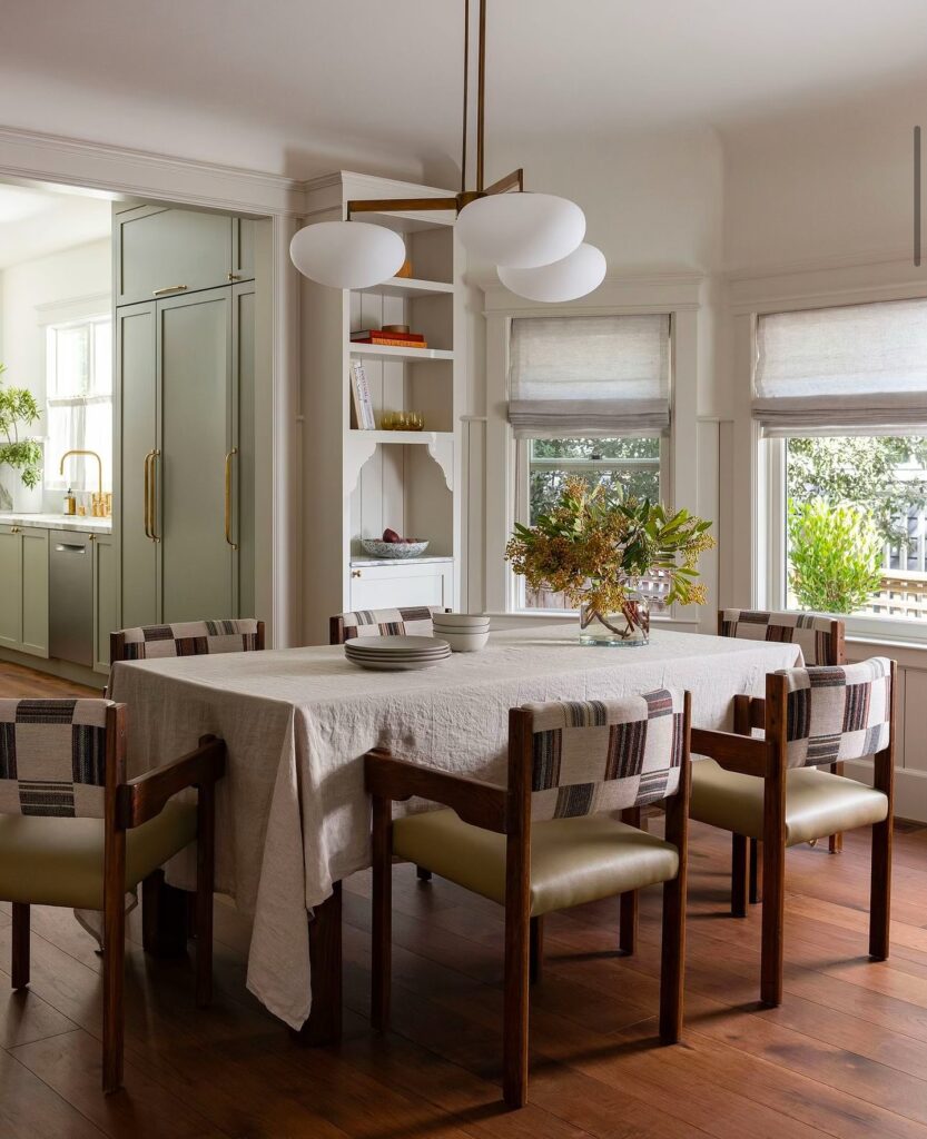 Bright and Eclectic Dining Room with Unique Lighting

