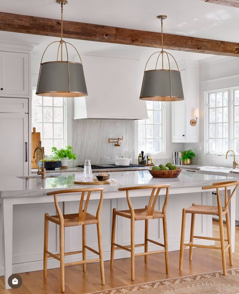 Bright and Modern Farmhouse Kitchen Island with Elegant Pendants

