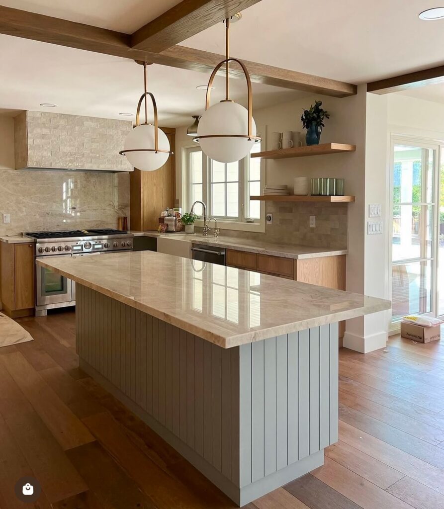 Bright and Modern Farmhouse Kitchen Island with Globe Pendants

