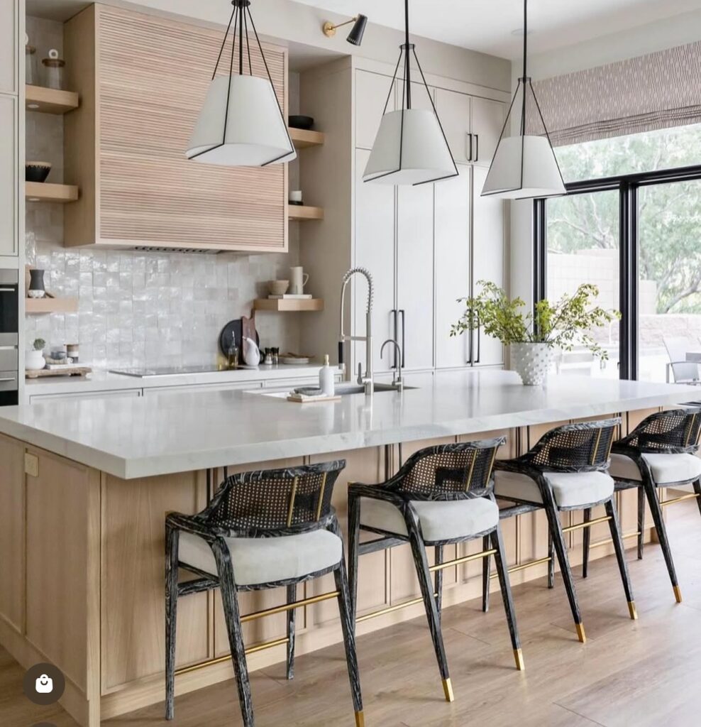 Bright and Modern Kitchen Island with Statement Pendants

