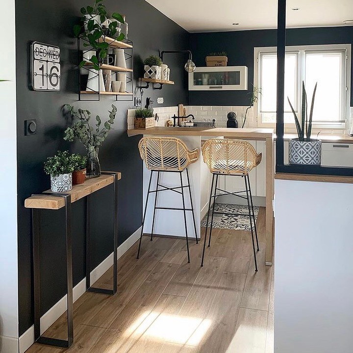 Cozy Kitchen Bar with Dark Walls and Natural Accents

