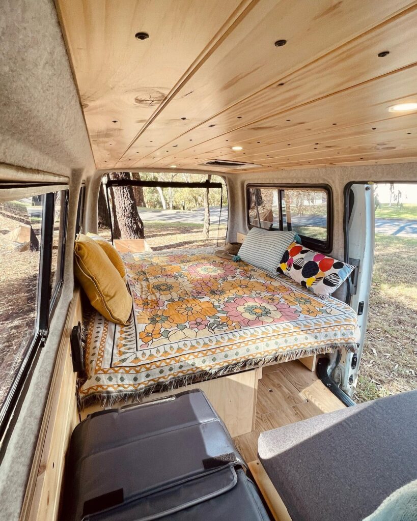 Cozy and Bright Small Camper Van Sleeping Area