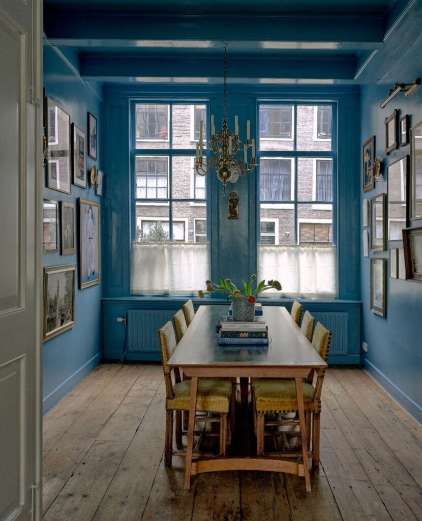 Eclectic Blue Dining Room with Gallery Walls

