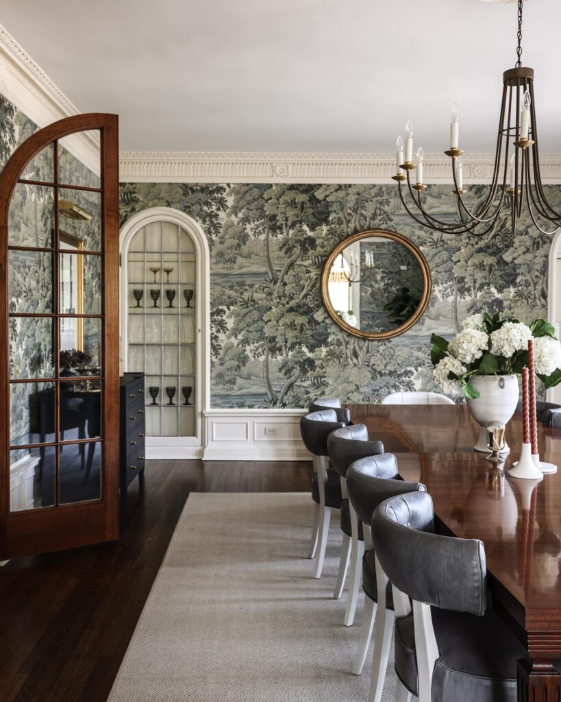 Elegant Dining Room with Scenic Wallpaper and Classic Chandelier
