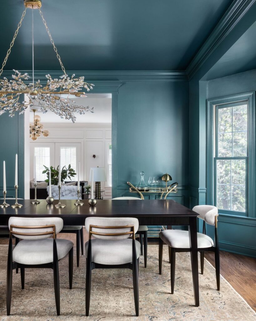 Elegant Teal Dining Room with Branch Chandelier

