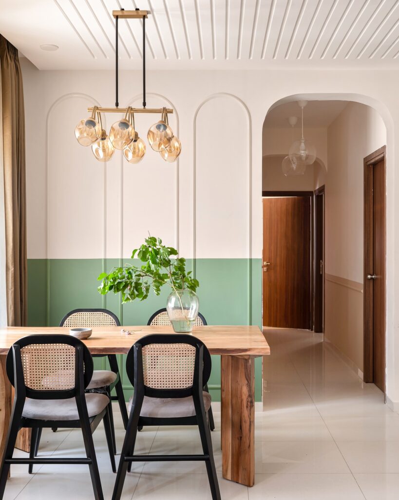 Modern Dining Area with Arched Details and Warm Lighting


