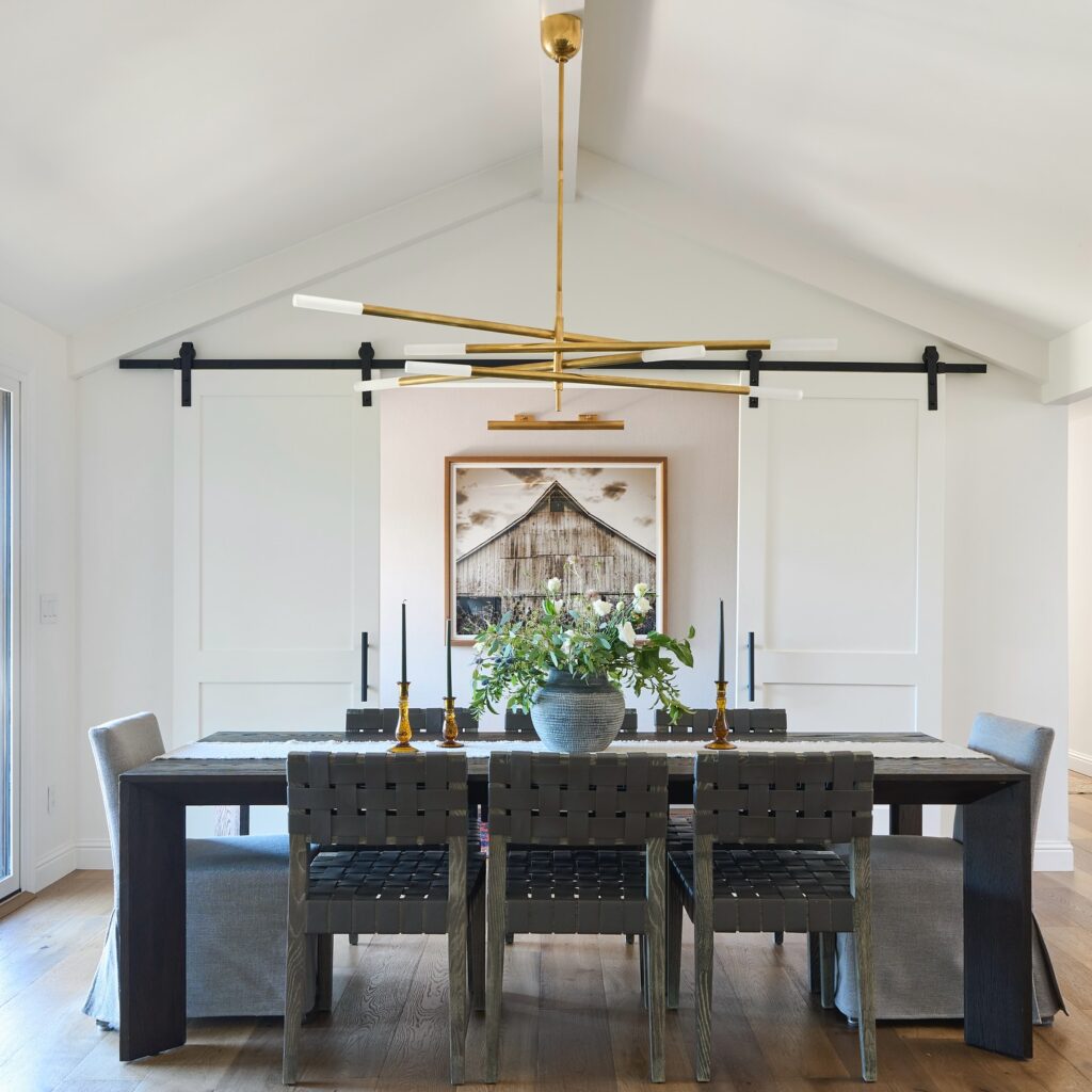 Modern Farmhouse Dining with Barn Door Accents
