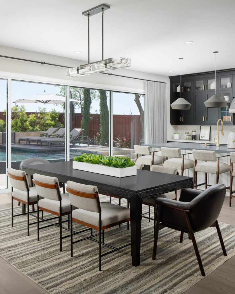 Modern Indoor-Outdoor Dining Space with Poolside Views

