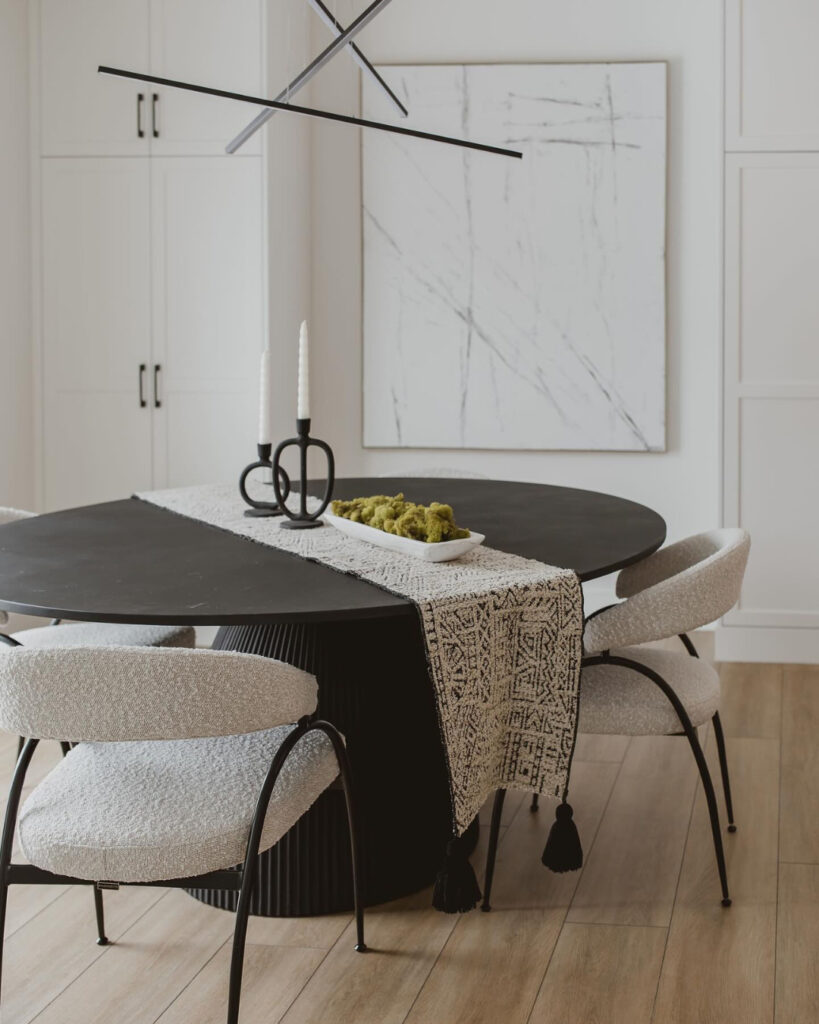 Modern Minimalist Dining Nook with Sculptural Lighting

