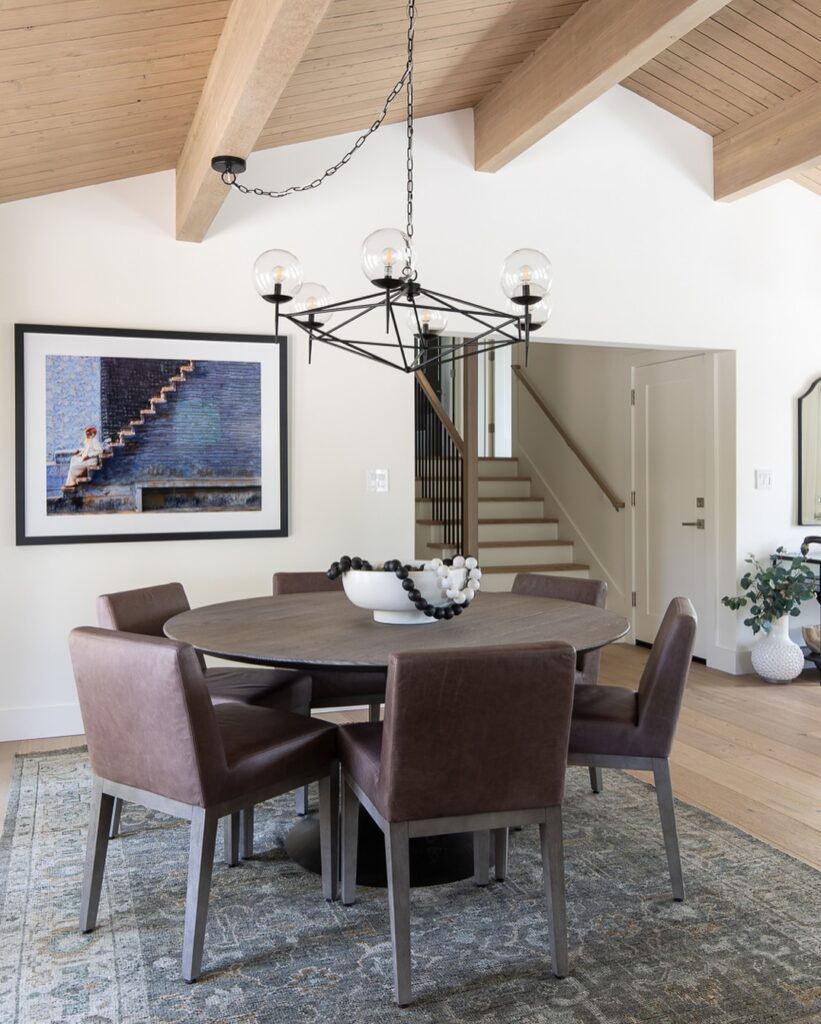 Modern Round Dining with Architectural Ceiling
