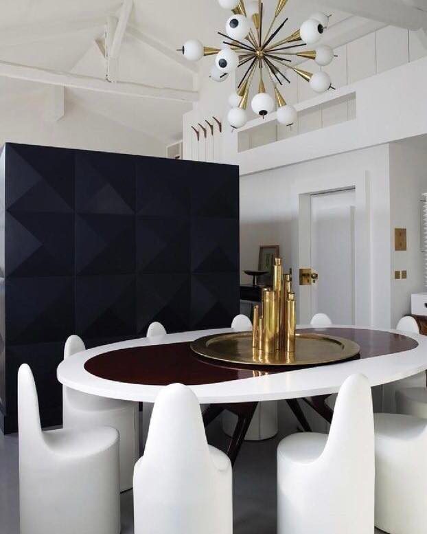 Modern and Sculptural Dining Space with Bold Accents
