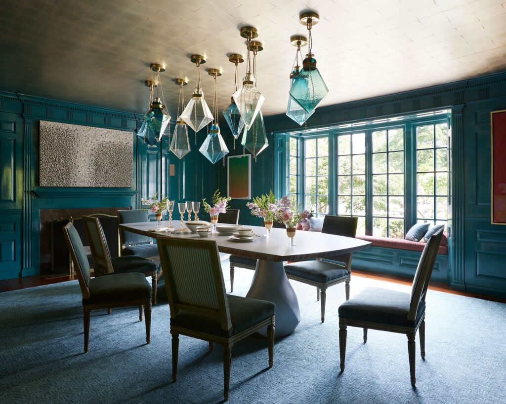 Moody Teal Dining Room with Geometric Pendants

