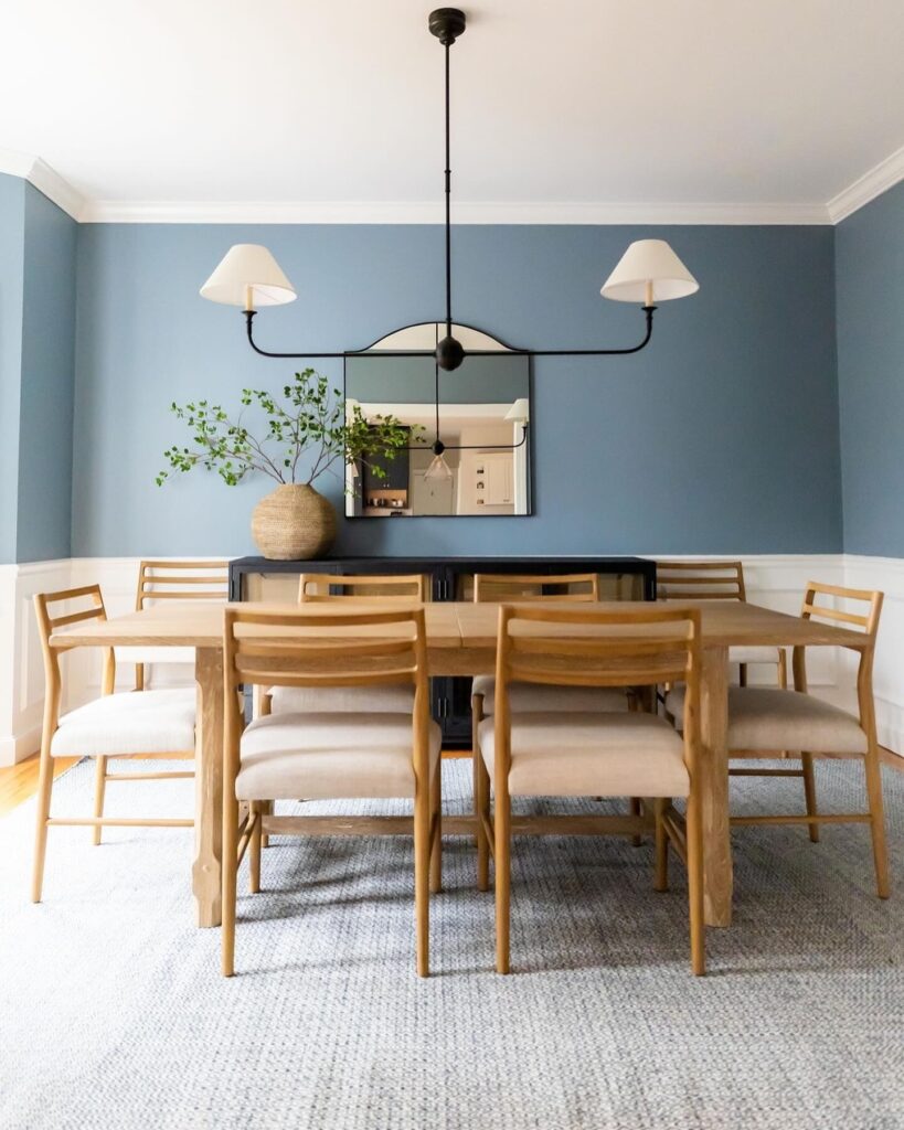 Serene Blue Dining Room with Modern Lighting
