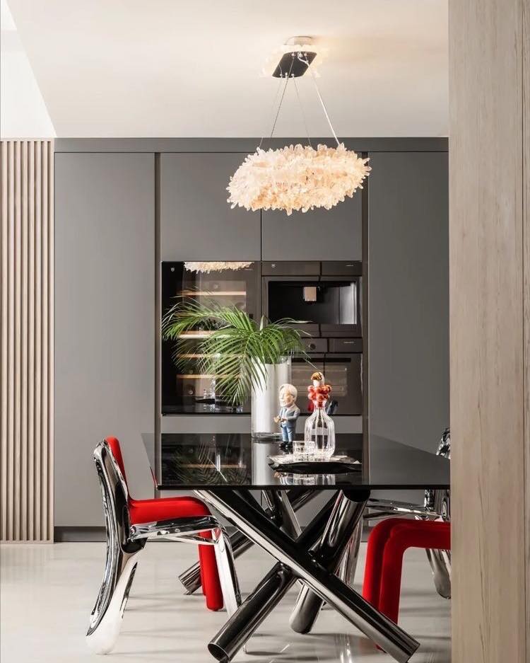 Sleek and Modern Dining Area with Artistic Lighting

