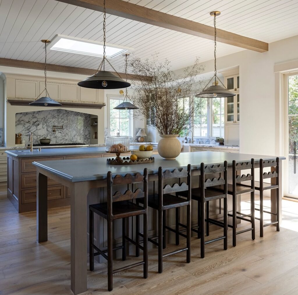 Spacious and Modern Farmhouse Kitchen Island with Pendant Lights

