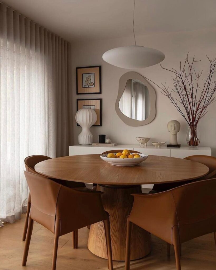 Warm Modern Dining Nook with Sculptural Accents

