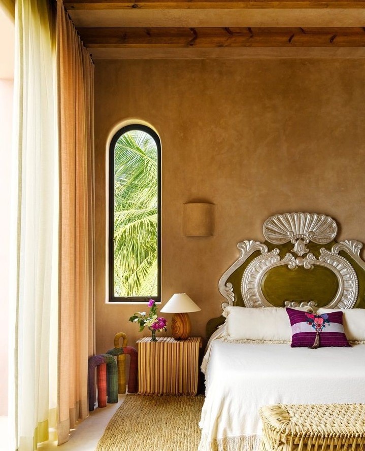 Warm and Exotic Bedroom with Arched Window


