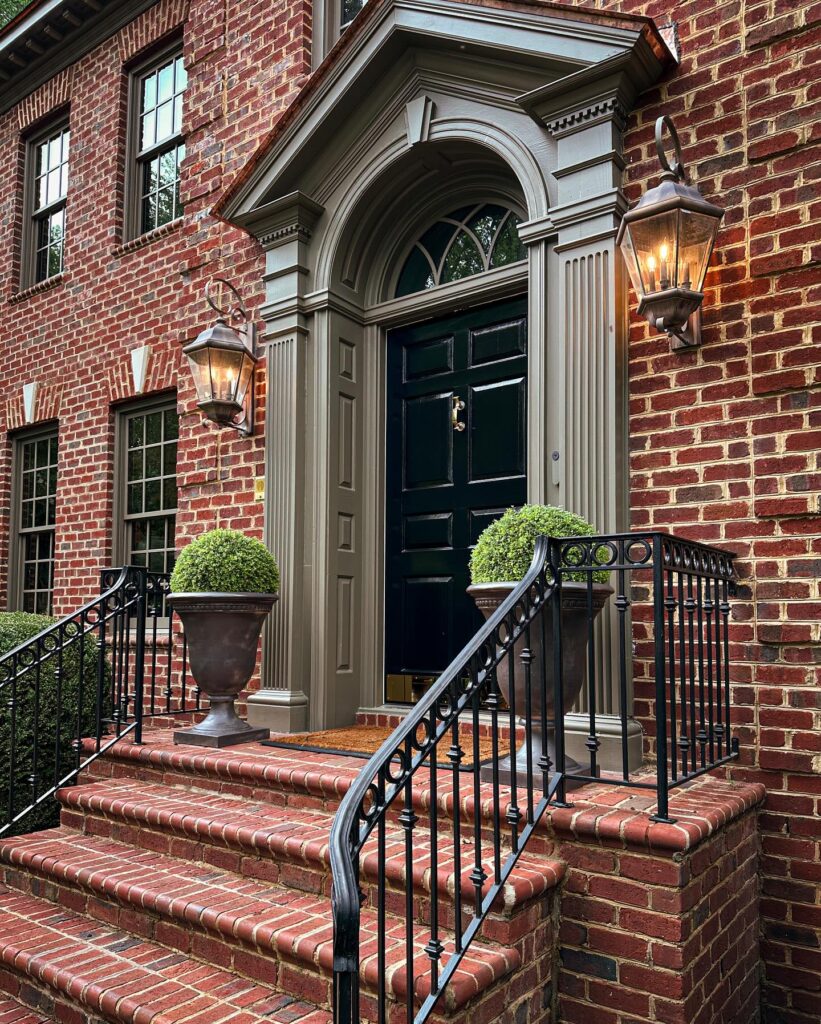 Classic Red Brick Home with Dark Green Door and Gray Trim
