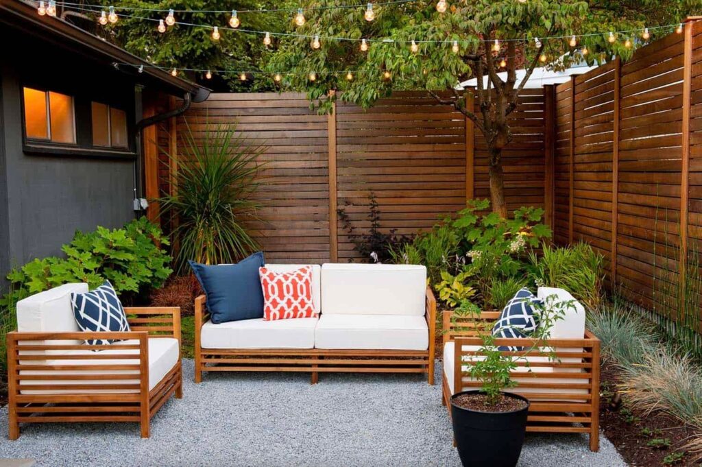 Cozy Patio Ambiance String Lights and Wooden Privacy
