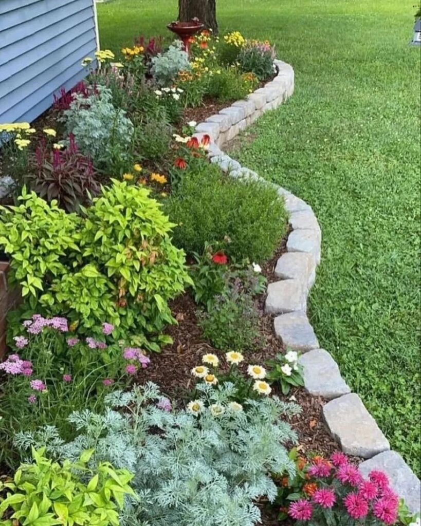 Curving Front Yard Flower Bed with Stone Edging
