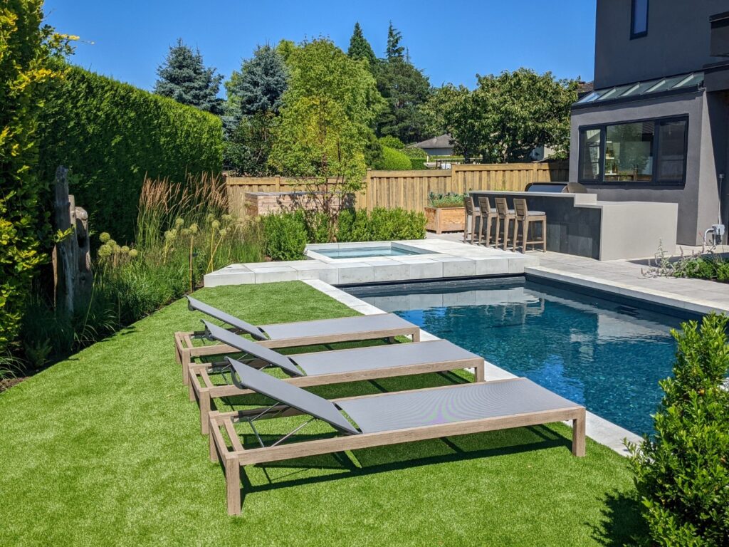 Ethimo Sand Sunbeds by a Pool
