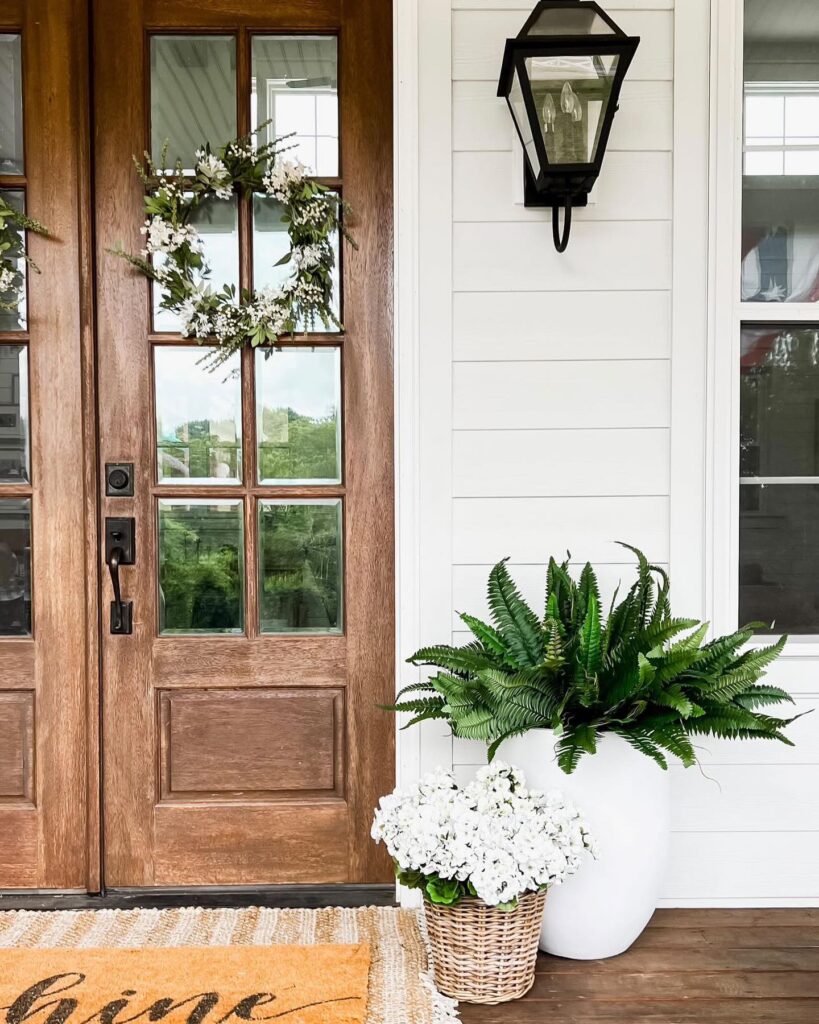 Inviting Porch Display with Lush Ferns
