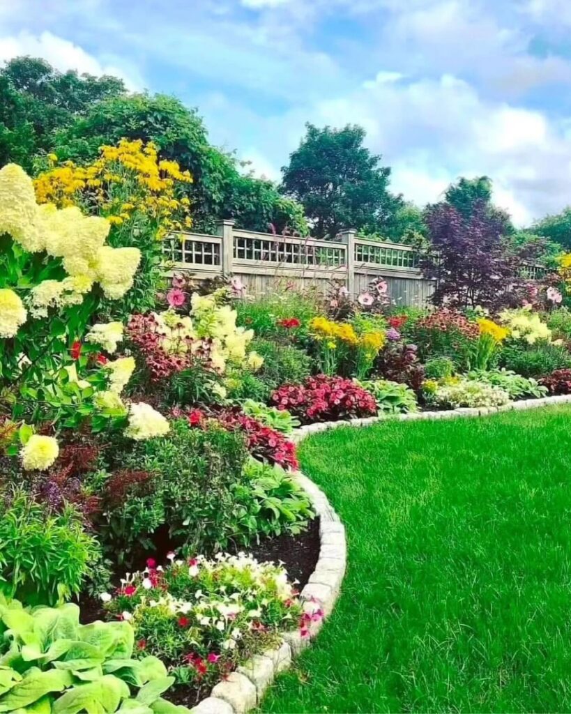 Lush and Layered Front Yard Flower Bed
