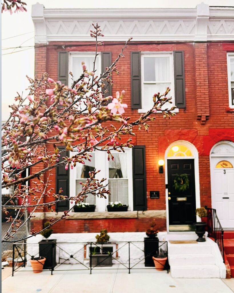 Red Brick Townhouse with Black Shutters
