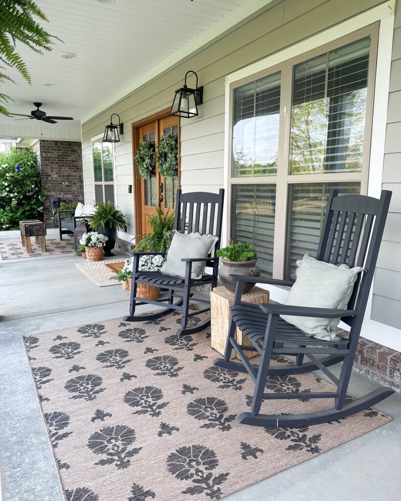 Relaxing Porch with Adirondack Chairs and Ferns
