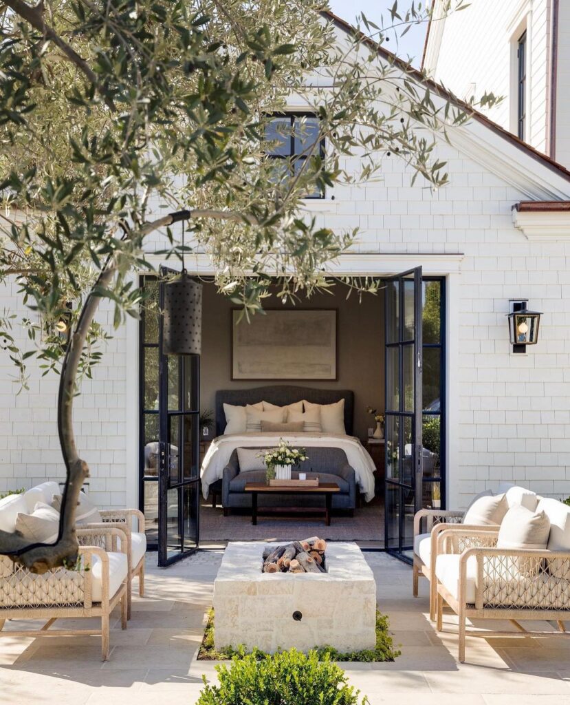 Seamless Indoor-Outdoor Living Bedroom Opening to Patio Fire Pit
