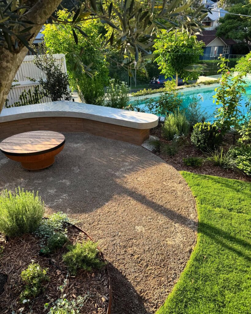 Serene Garden Retreat Curved Bench and Poolside View
