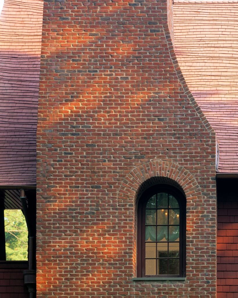 Textured Red Brick Exterior with Arched Window

