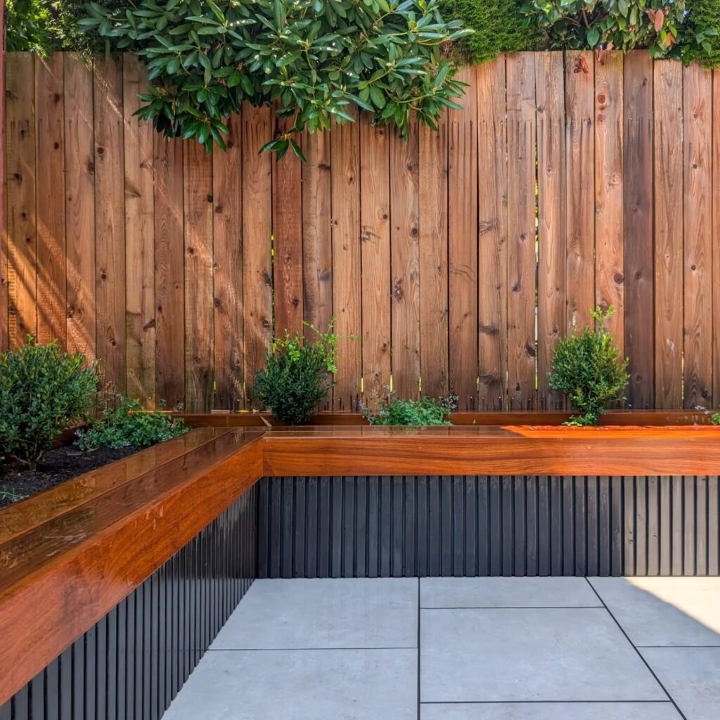 Tiered Garden Privacy Wood, Stone, and Lush Greenery
