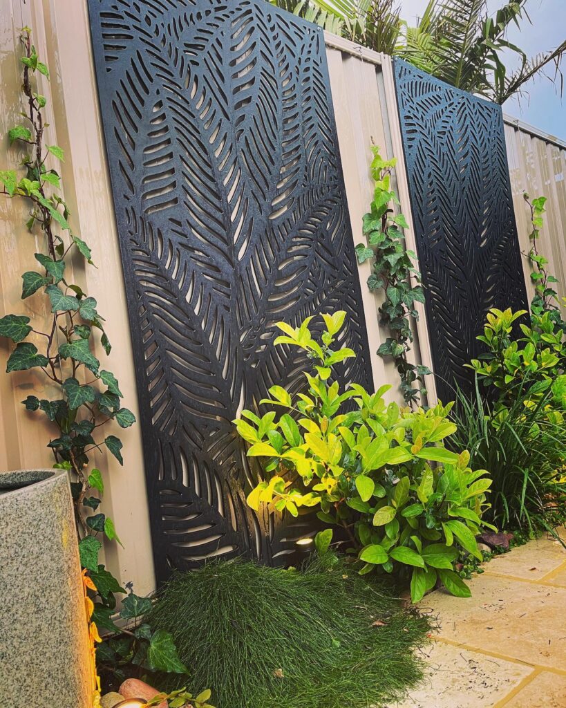 Tropical Privacy Laser-Cut Panels and Lush Foliage
