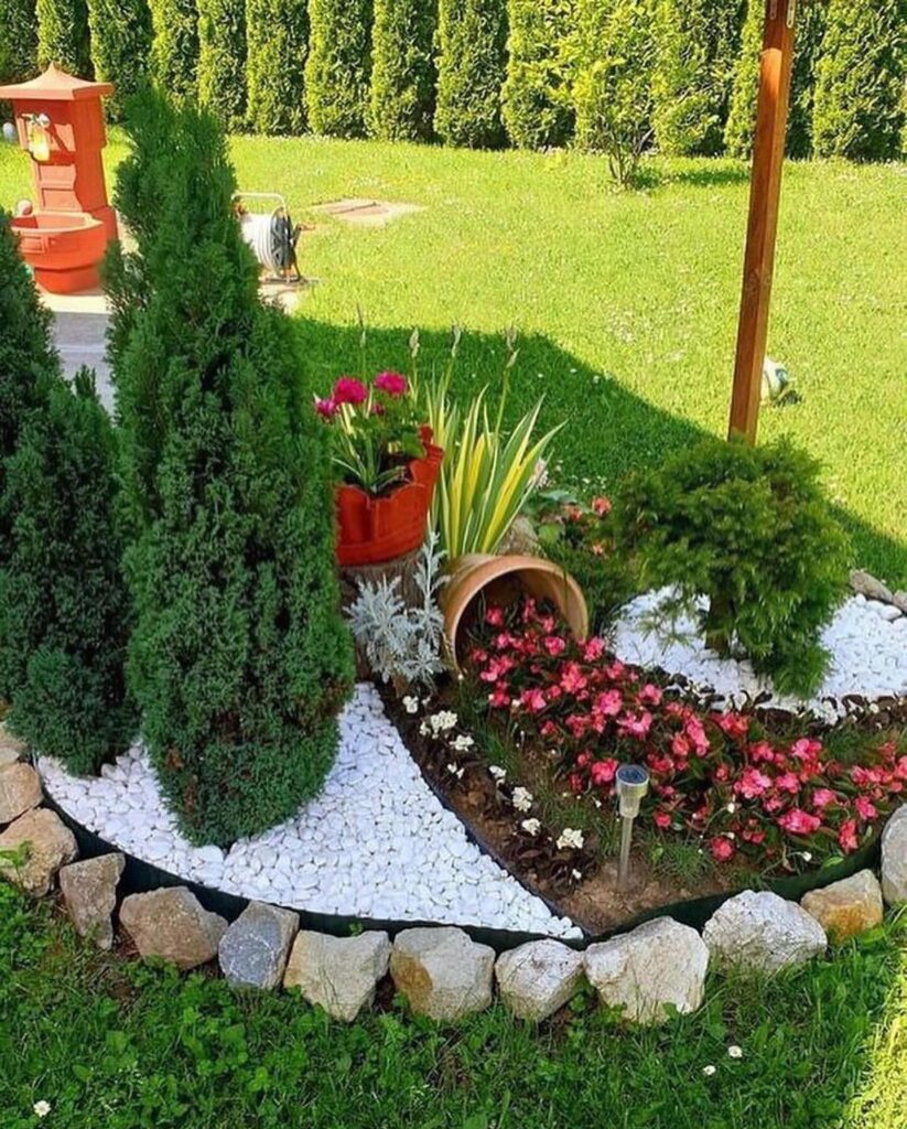 Whimsical Garden Display Spilled Pot and Colorful Blooms
